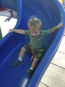 Austin enjoying the big kid slide